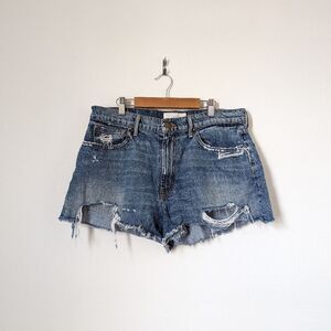 THE GREAT. medium wash blue denim cut off frayed distressed mini jean shorts
